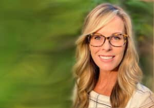 A glasses-wearing woman named Kimberlee Mitchell joins DVULI as the communications manager to lead national branding.