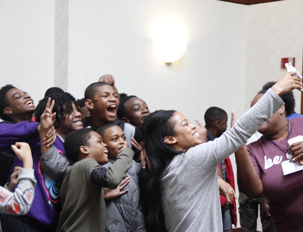 Homepage featuring a diverse group of people posing for a photo, showcasing community and inclusion.