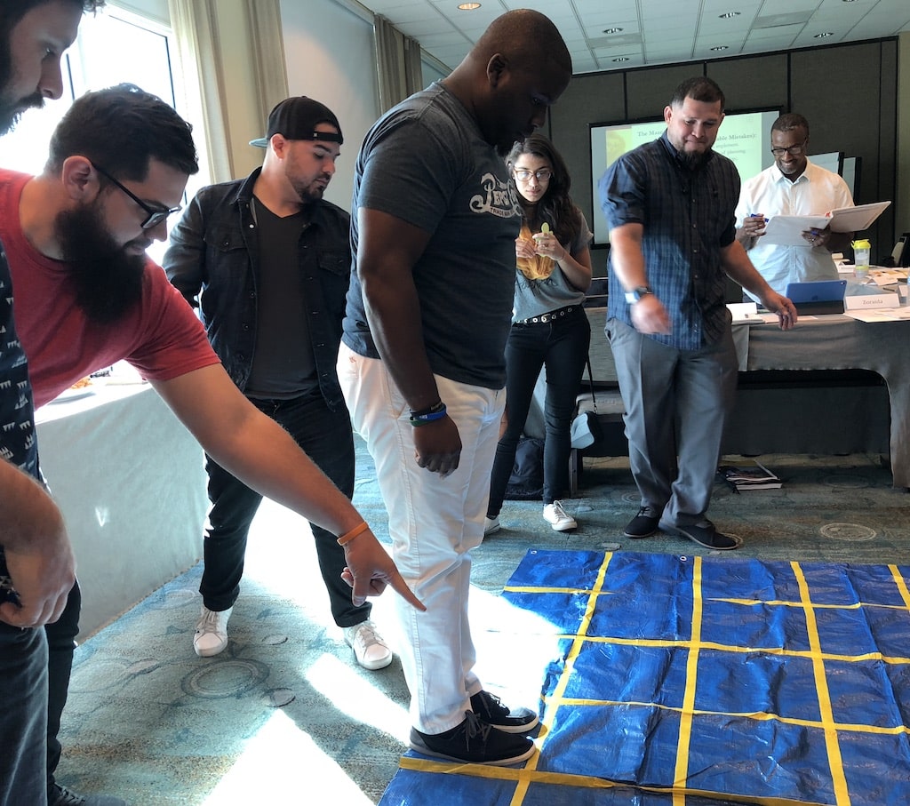 Homepage featuring a diverse group of people in a room, promoting resources for urban youth leaders.