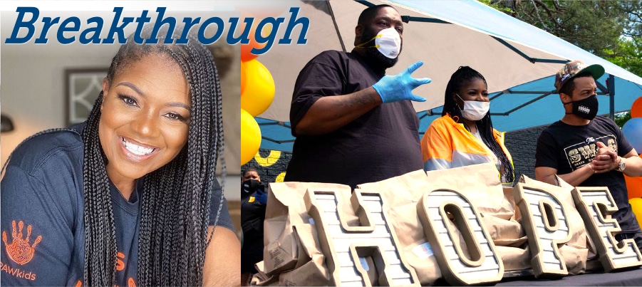 Image of a woman holding a sign saying "breakthrough hope", LaTonya Gates, founder of Claudia's House providing food to Grove Park community.