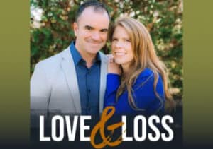 A man and woman pose for a photo with the words "Love and Loss" by Pam Harris (Kansas City 2008).