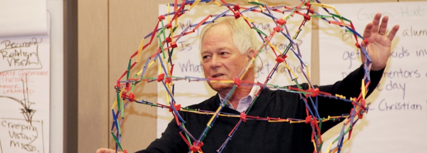Peter O'Donnell holds a Hoberman sphere.